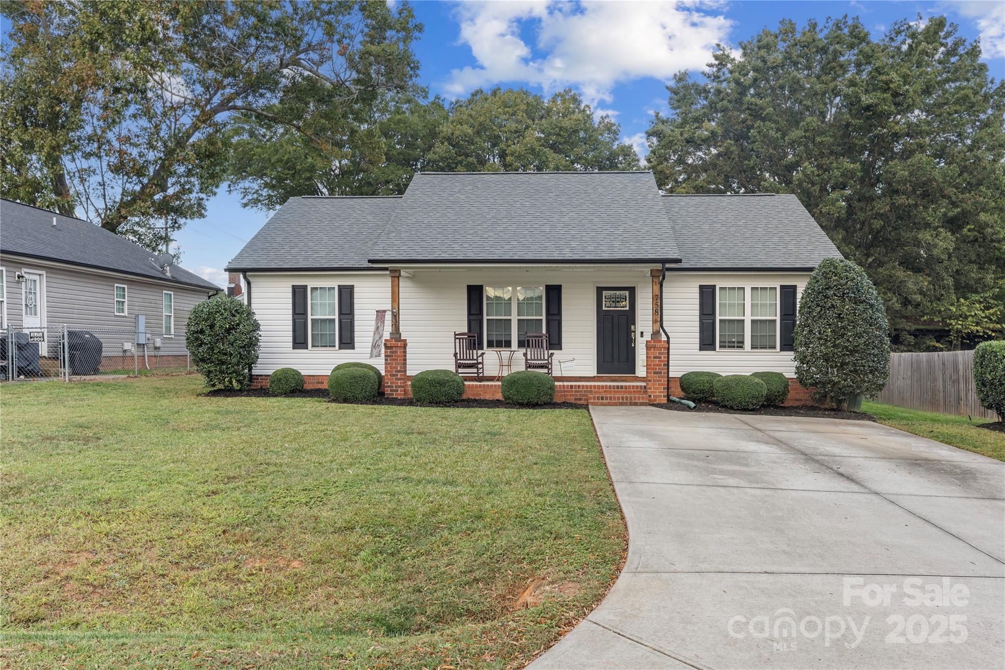 758 Main Street Southwest Concord, NC 28027 - Photo 2 of 25 a front view of a house with a yard