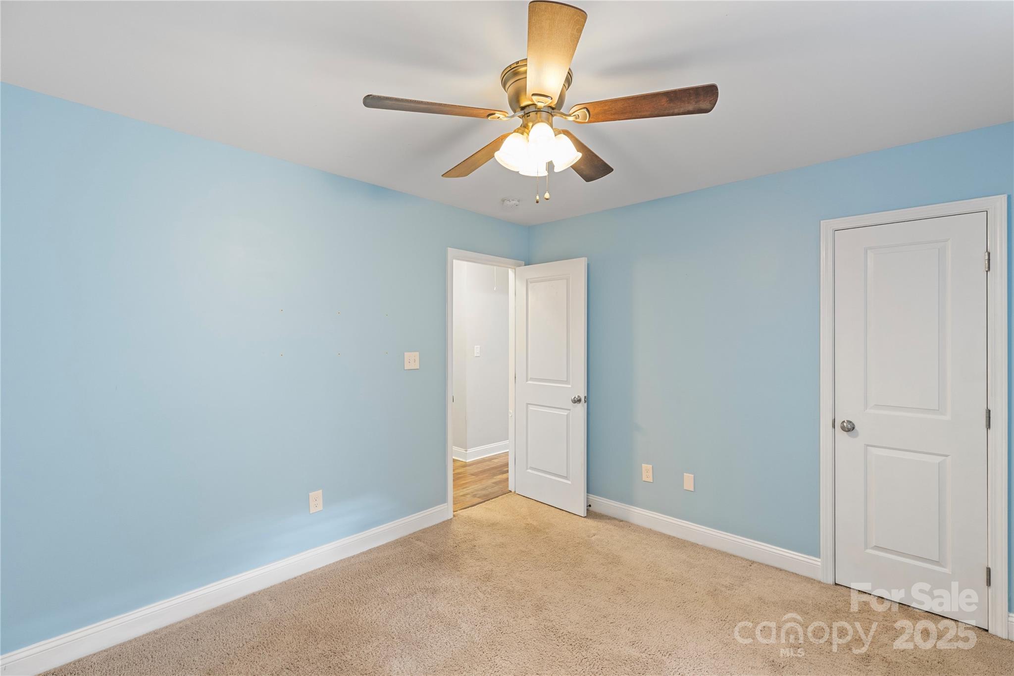 758 Main Street Southwest Concord, NC 28027 - Photo 21 of 25 an empty room and chandelier fan