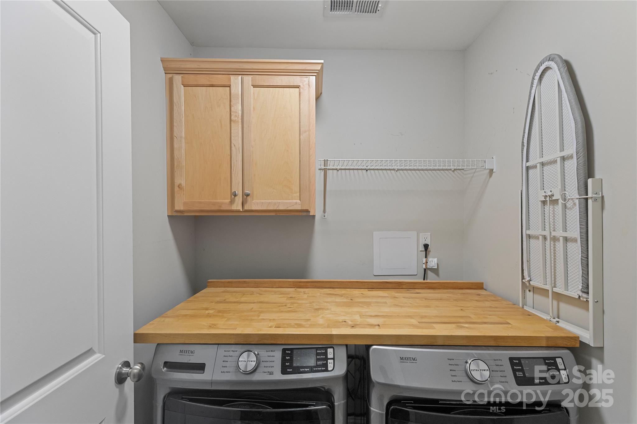 758 Main Street Southwest Concord, NC 28027 - Photo 24 of 25 a room with a table and a wooden floor