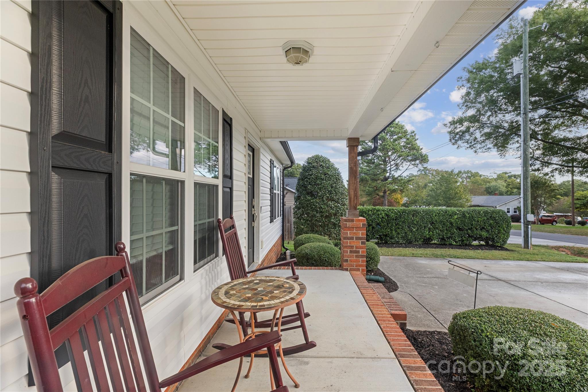 758 Main Street Southwest Concord, NC 28027 - Photo 4 of 25 a view of a patio with a table chairs and a backyard