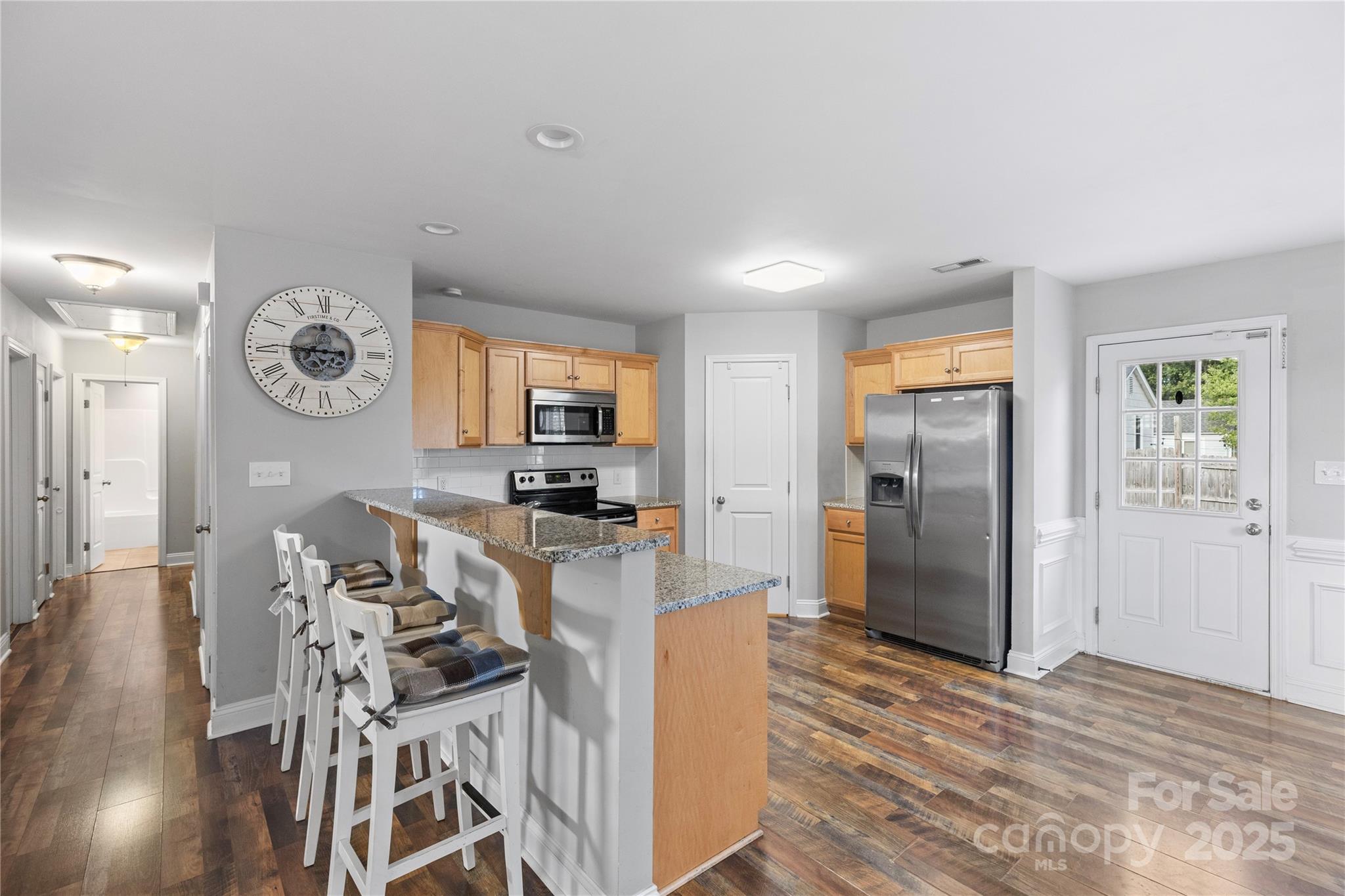 758 Main Street Southwest Concord, NC 28027 - Photo 7 of 25 a view of a kitchen with furniture and wooden floor