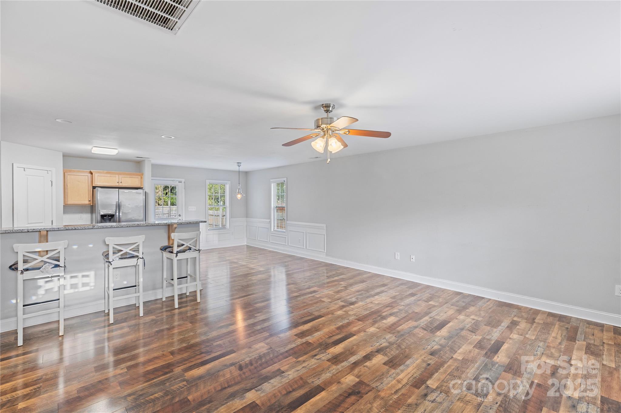 758 Main Street Southwest Concord, NC 28027 - Photo 10 of 25 a view of kitchen with furniture and wooden floor