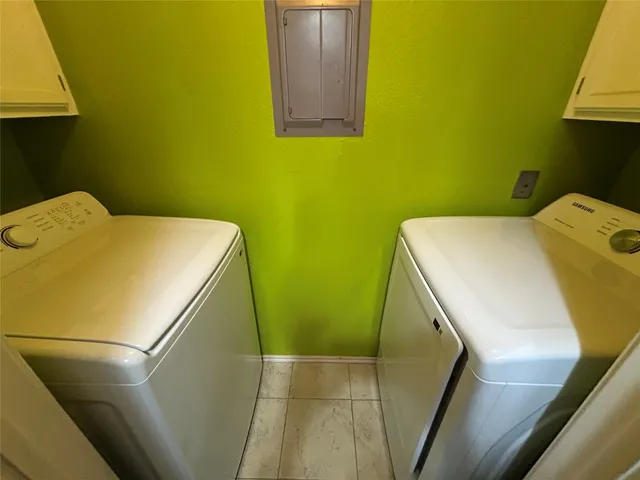 a utility room with dryer and washer