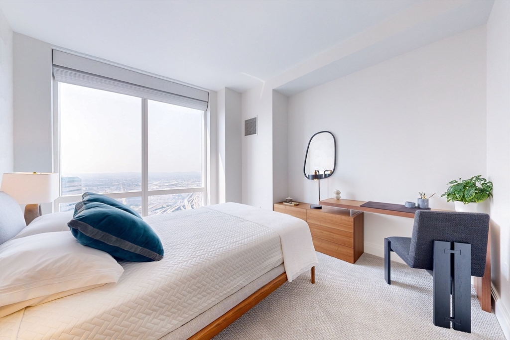 240 Devonshire Street, Unit 4706 Boston, MA 02110 - Photo 11 of 40 a bedroom with a bed lamps and windows