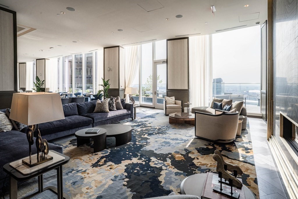 240 Devonshire Street, Unit 4706 Boston, MA 02110 - Photo 17 of 40 a living room with furniture and floor to ceiling windows