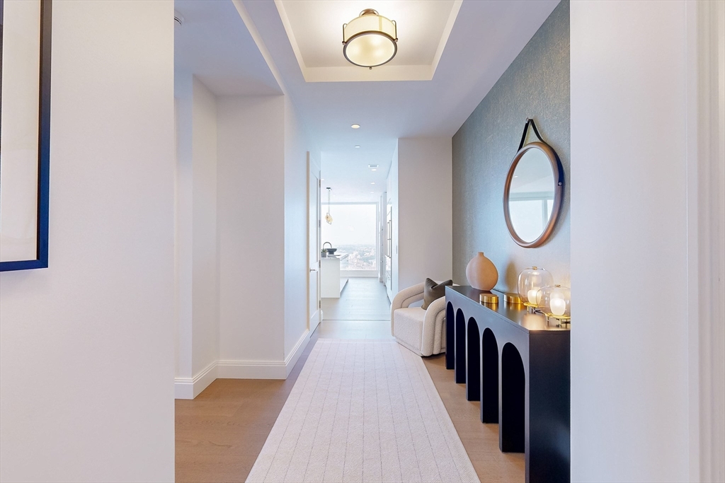 240 Devonshire Street, Unit 4706 Boston, MA 02110 - Photo 6 of 40 a view of a hallway of a livingroom with furniture