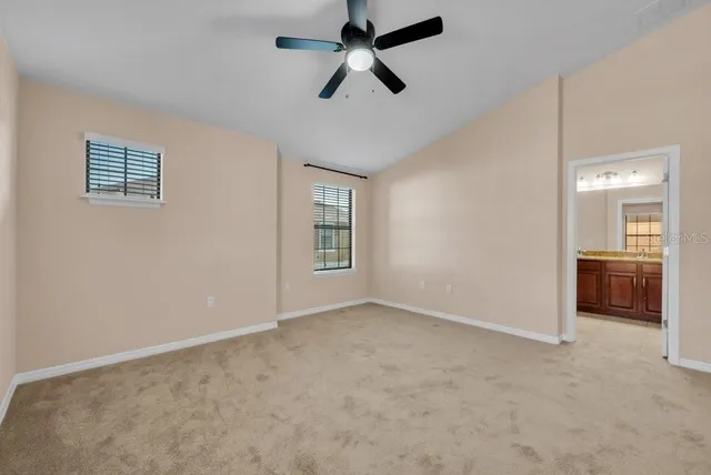 an empty room with a empty space and a ceiling fan