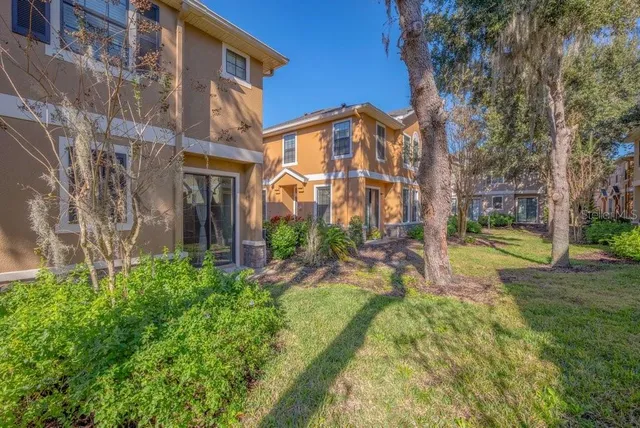 a view of a building with a yard