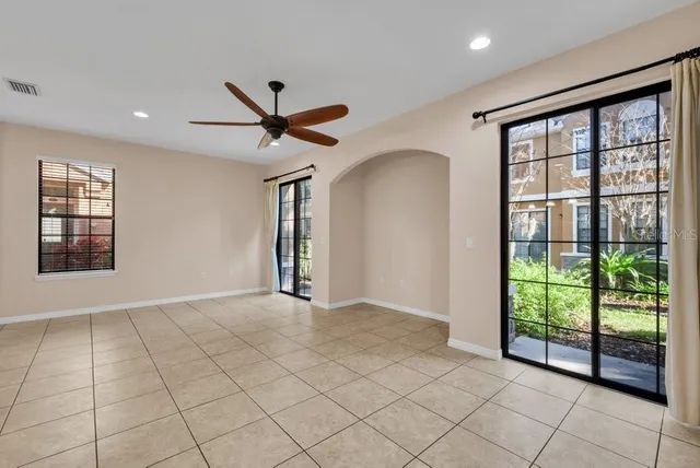 a kitchen with stainless steel appliances granite countertop a sink refrigerator and microwave