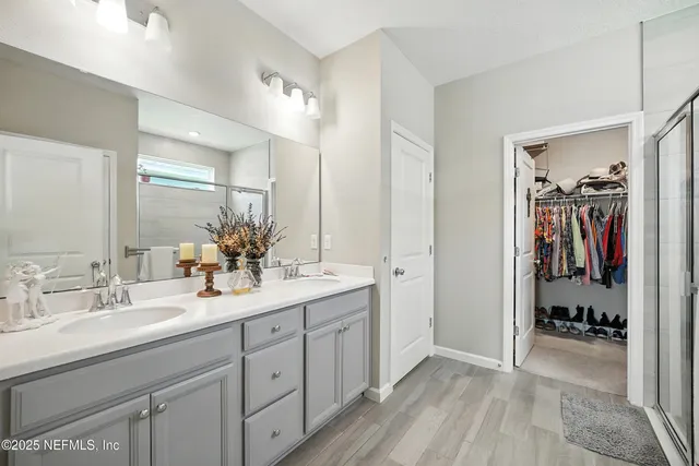 a bathroom with a shower and a bath tub