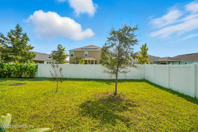 a aerial view of a house with swimming pool