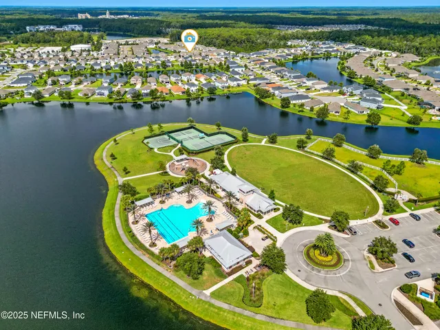 a view of an swimming pool with seating area
