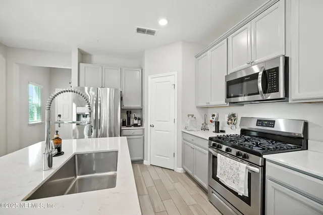 a kitchen with a stove and a microwave