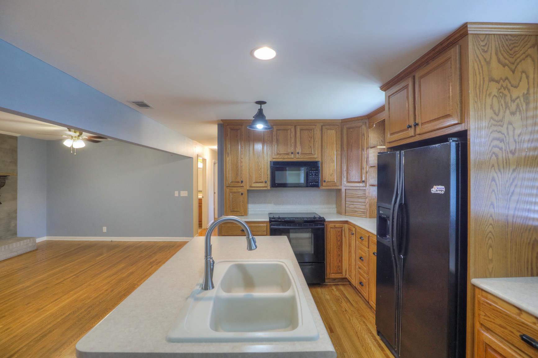 3144 Battle Creek Road Springfield, TN 37172 - Photo 12 of 28 a kitchen with stainless steel appliances granite countertop a sink refrigerator and cabinets