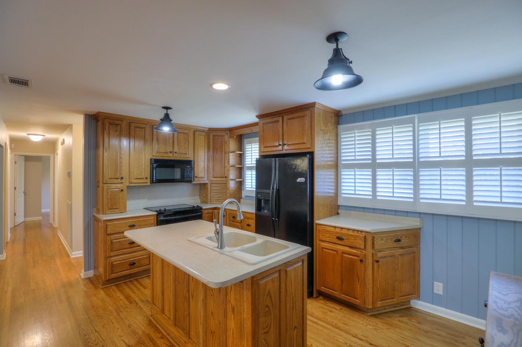 3144 Battle Creek Road Springfield, TN 37172 - Photo 14 of 28 a kitchen with stainless steel appliances granite countertop a sink refrigerator and cabinets