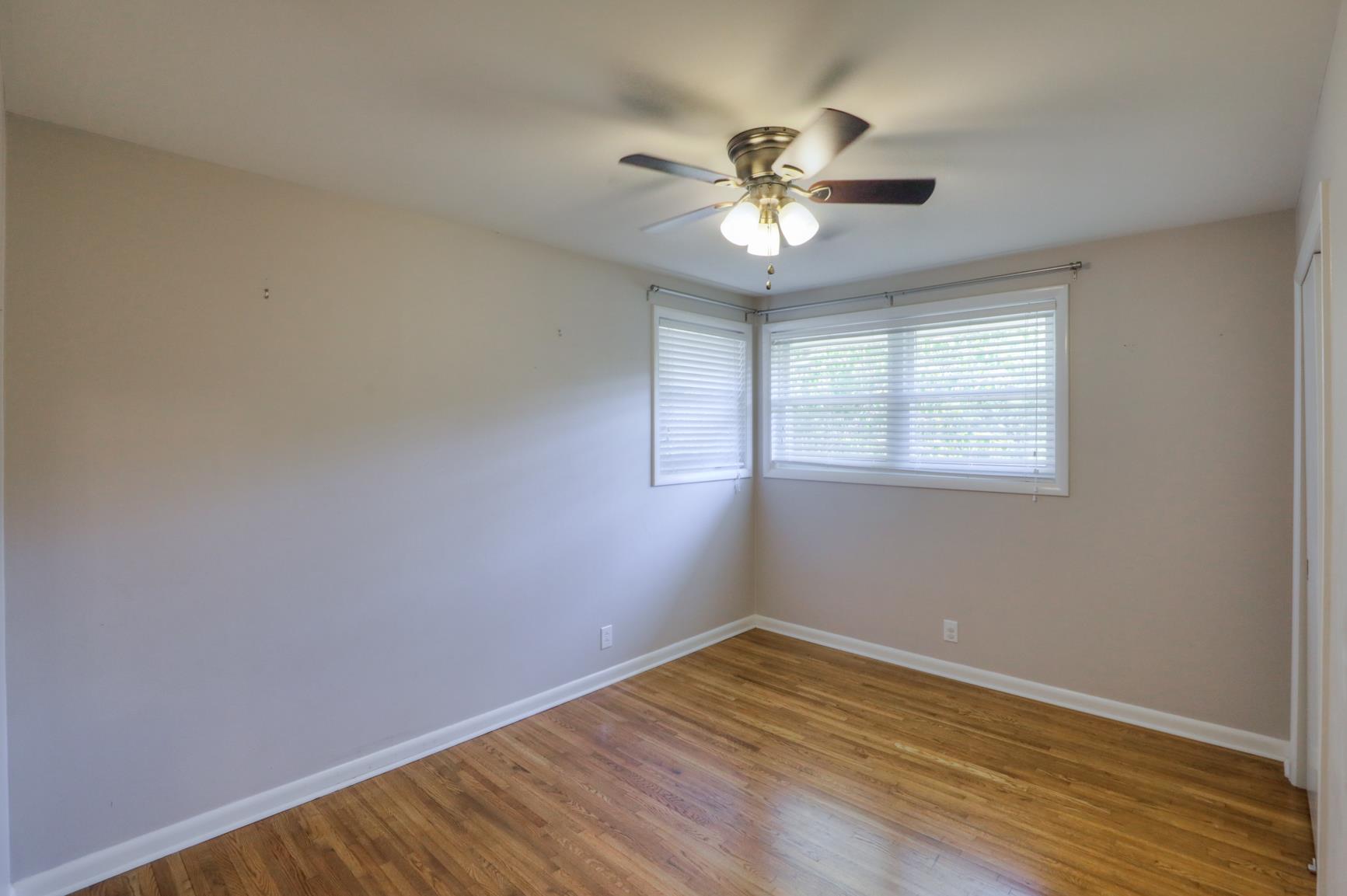 3144 Battle Creek Road Springfield, TN 37172 - Photo 18 of 28 a view of an empty room with wooden floor and a window
