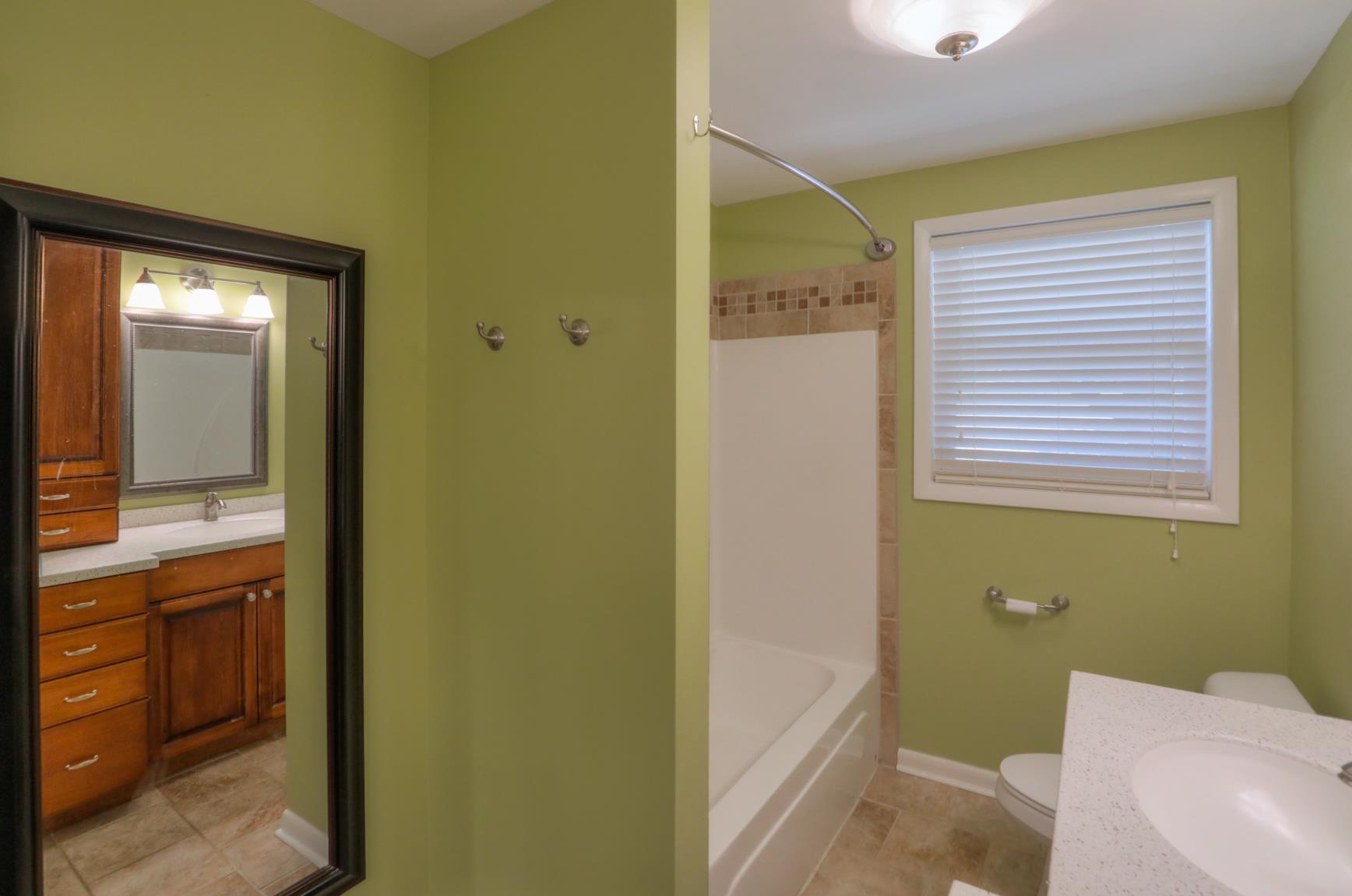 3144 Battle Creek Road Springfield, TN 37172 - Photo 20 of 28 a bathroom with a bathtub and a sink