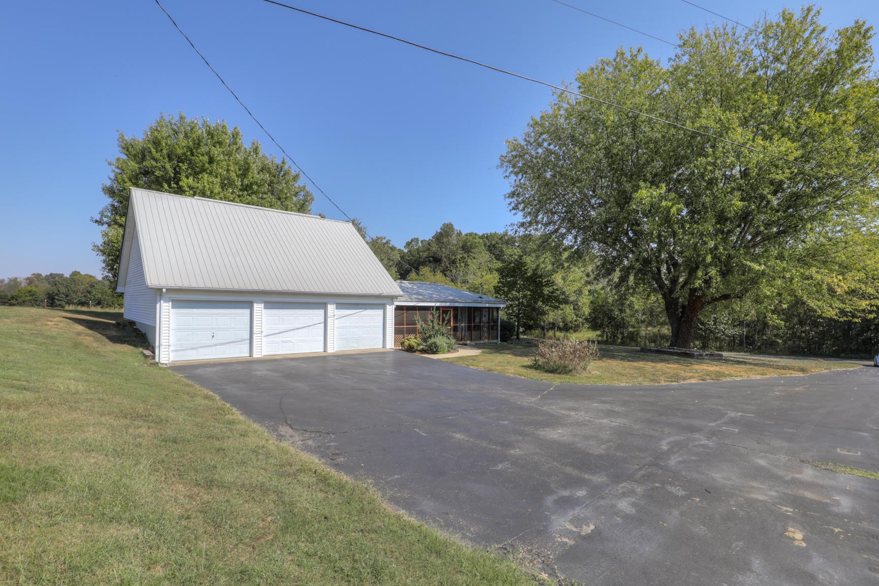 3144 Battle Creek Road Springfield, TN 37172 - Photo 24 of 28 front view of a house with a yard and potted plants
