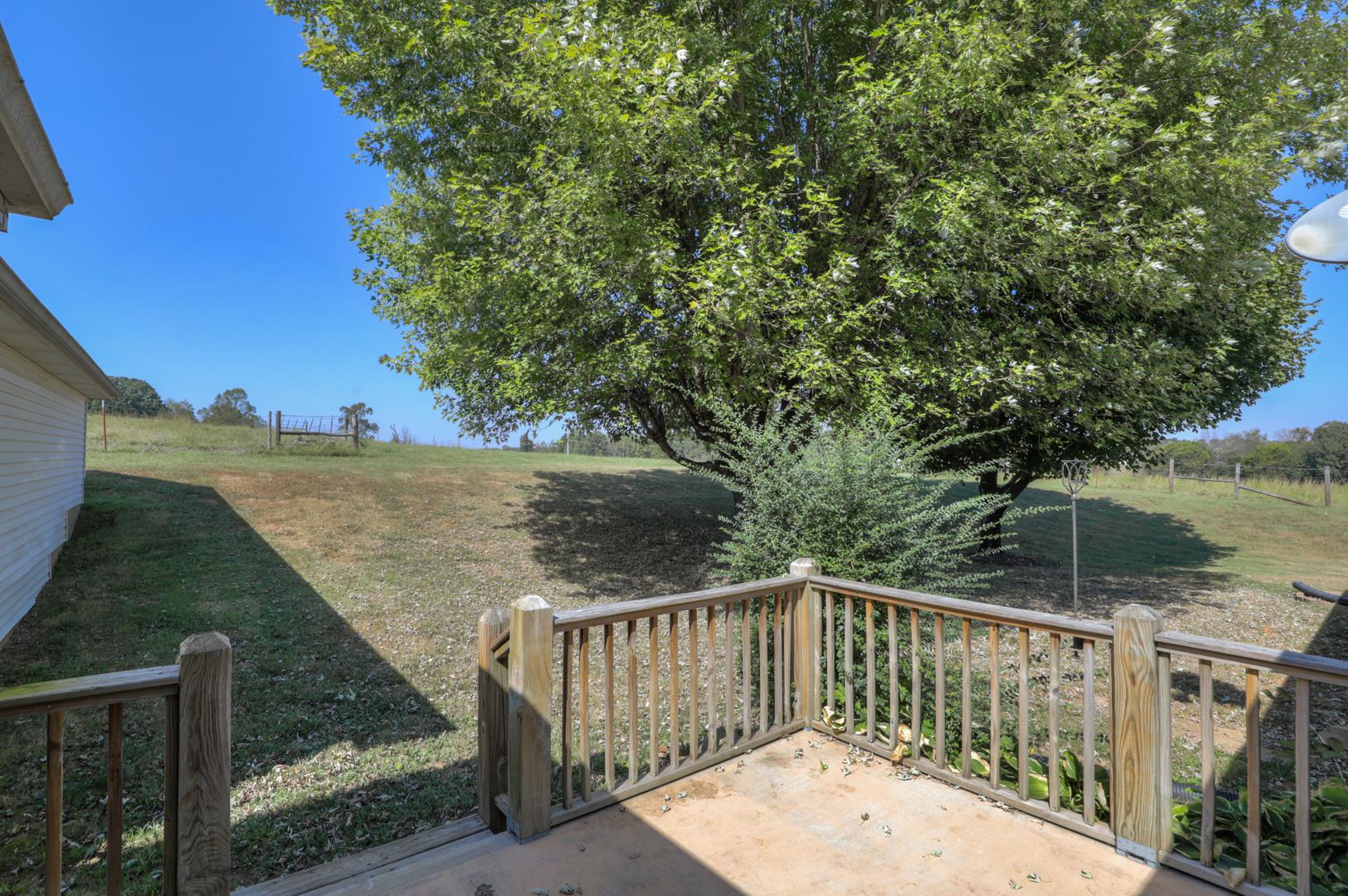 3144 Battle Creek Road Springfield, TN 37172 - Photo 25 of 28 a balcony with wooden floor and yard in the back
