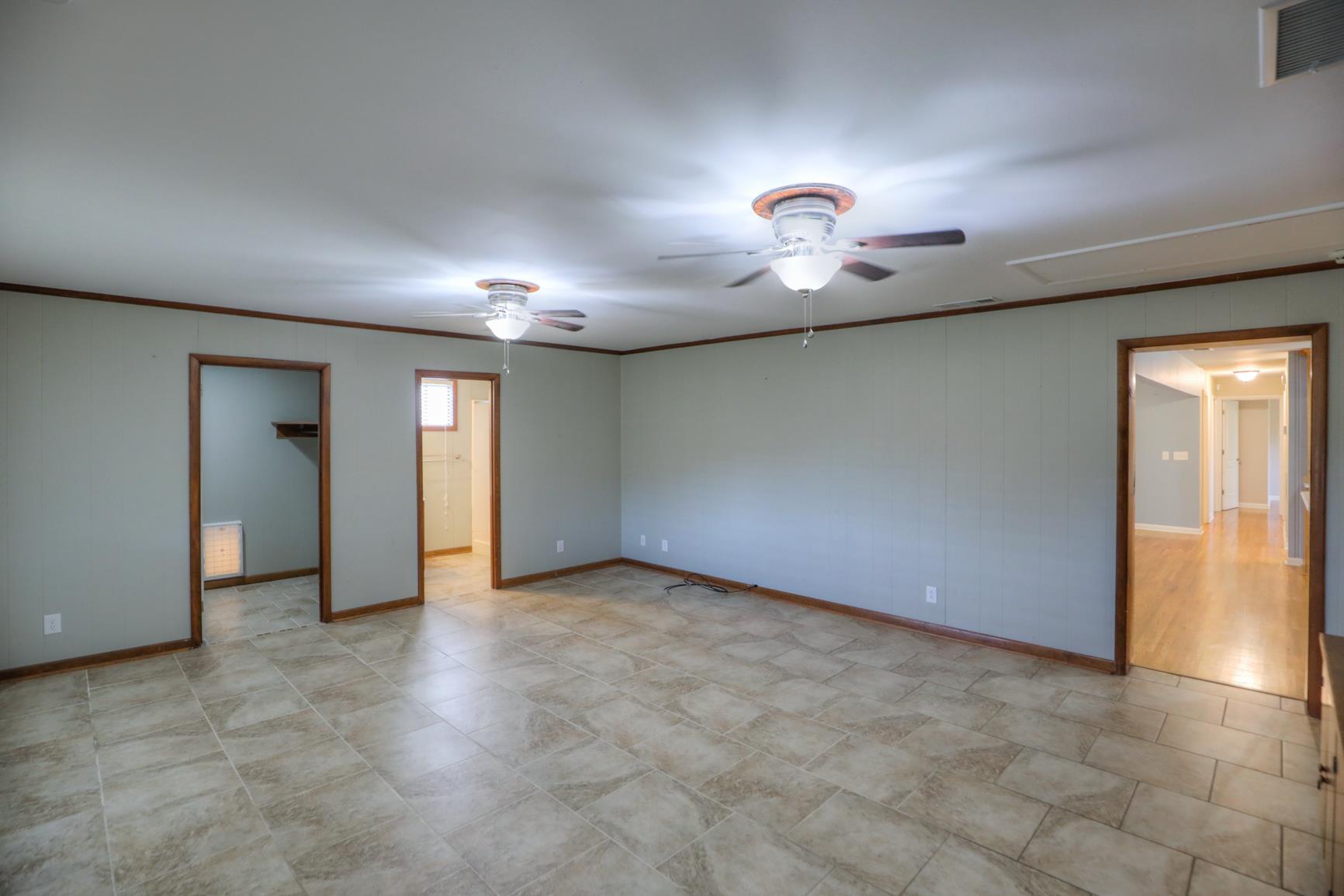 3144 Battle Creek Road Springfield, TN 37172 - Photo 7 of 28 an empty room with closet and chandelier fan