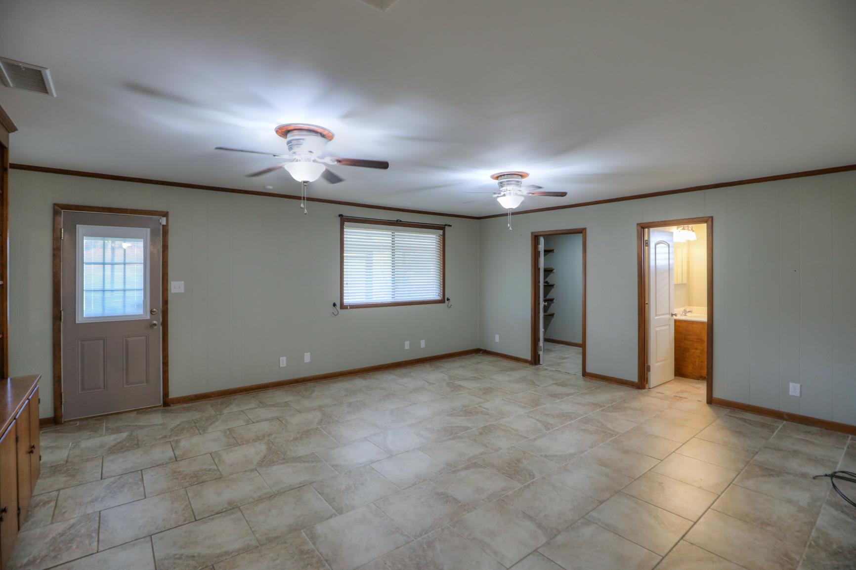 3144 Battle Creek Road Springfield, TN 37172 - Photo 8 of 28 an empty room with windows and fireplace