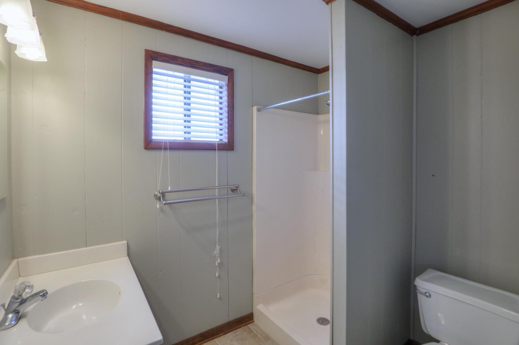 3144 Battle Creek Road Springfield, TN 37172 - Photo 9 of 28 a bathroom with a sink and a toilet