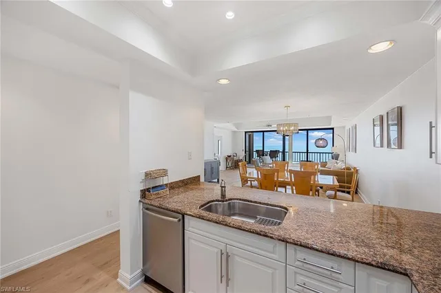 a kitchen with granite countertop a sink and a granite counter top