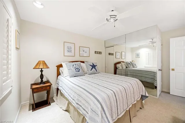 a bedroom with bed and a chandelier