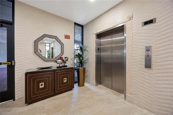 a kitchen with stainless steel appliances granite countertop a stove a refrigerator and a microwave