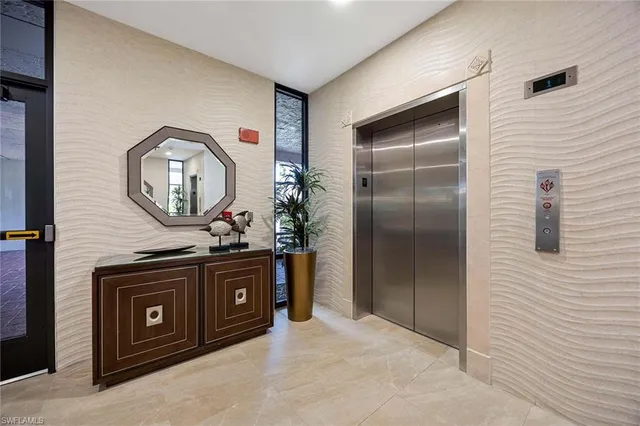 a kitchen with stainless steel appliances granite countertop a stove a refrigerator and a microwave