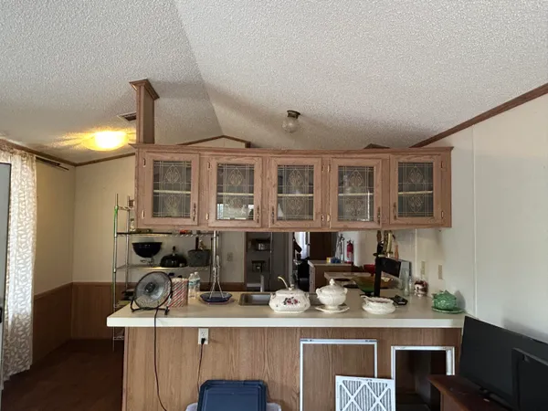 a kitchen with cabinets a sink and a stove