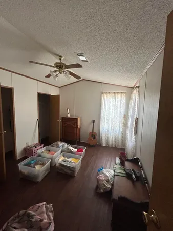 a bed room with furniture and a window