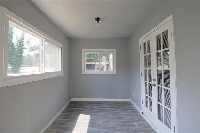a view of empty room with windows