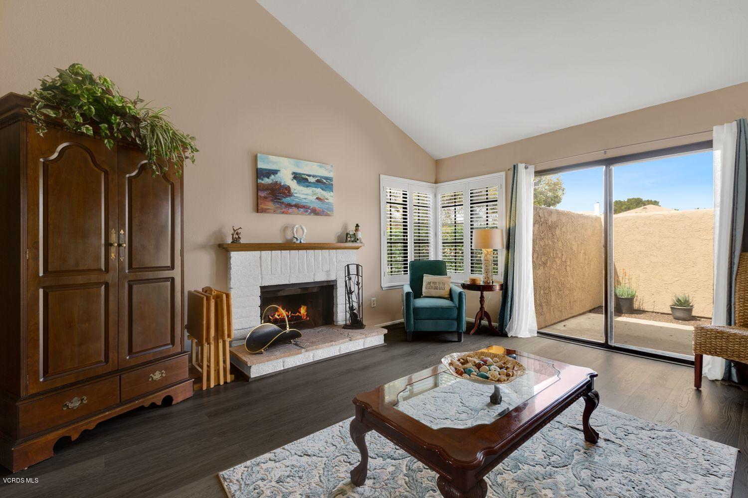 3736 Via Pacifica Walk Oxnard, CA 93035 - Photo 2 of 20 a living room with furniture and a fireplace