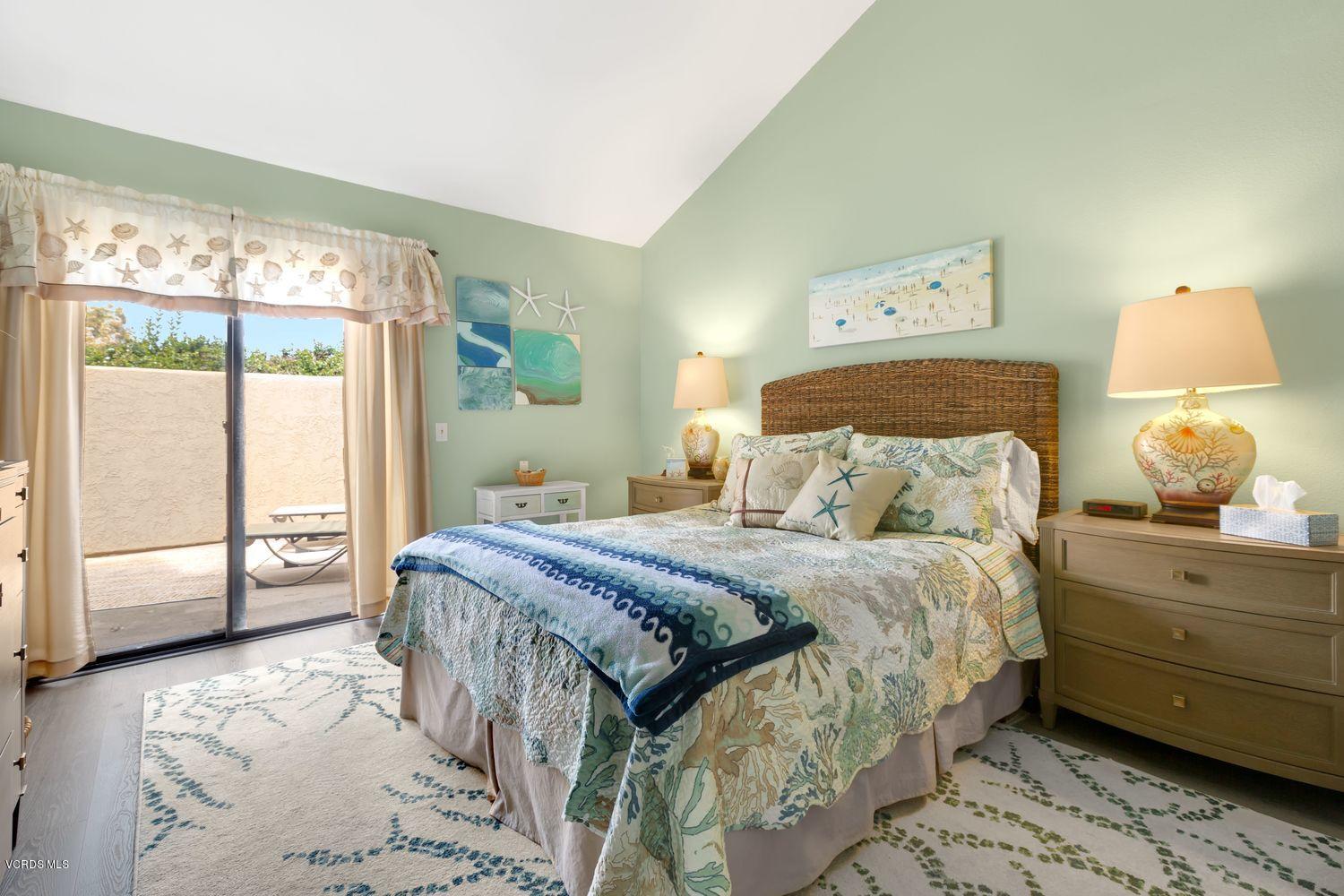 3736 Via Pacifica Walk Oxnard, CA 93035 - Photo 13 of 20 a bedroom with a bed and wooden floor