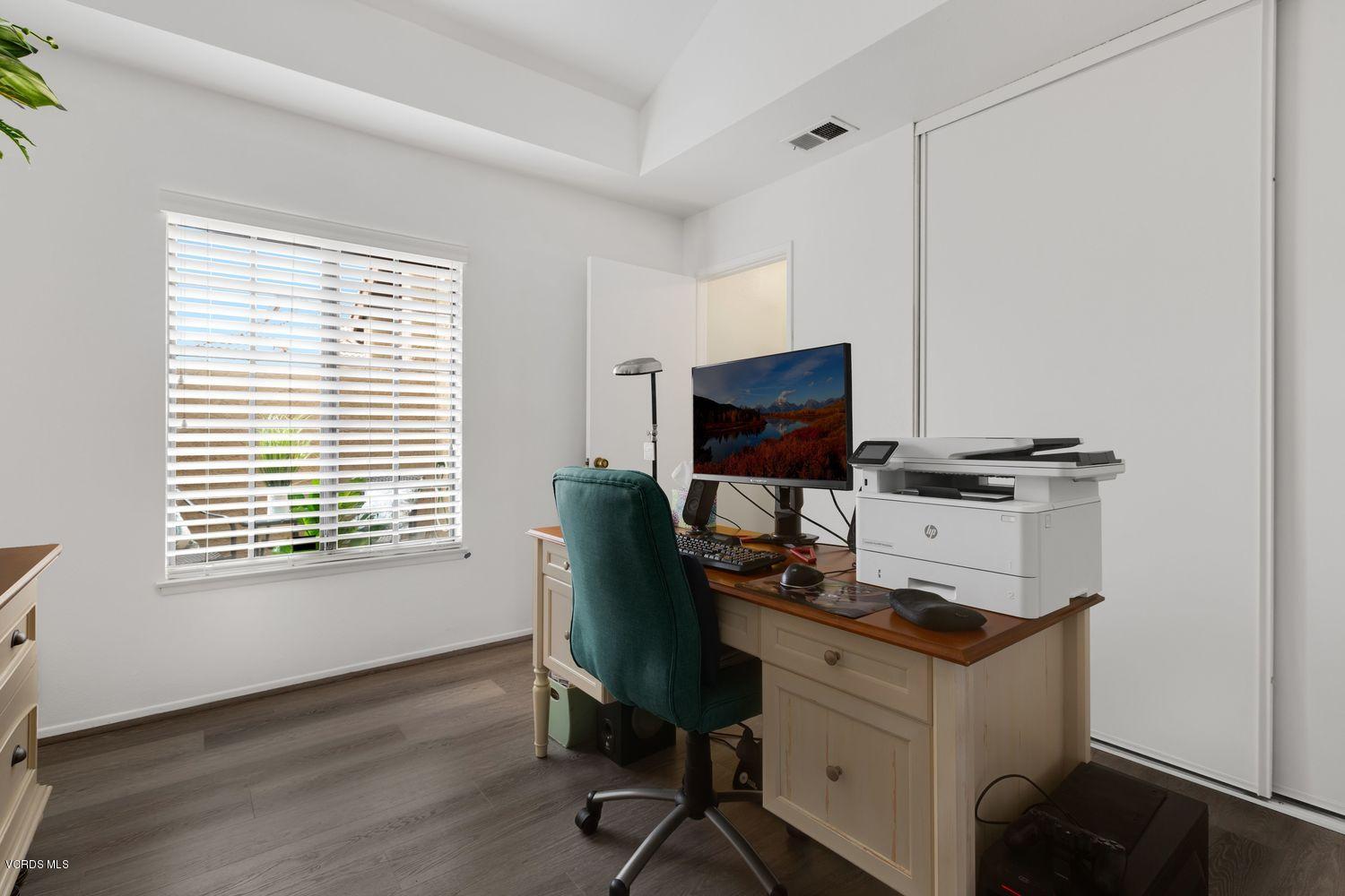 3736 Via Pacifica Walk Oxnard, CA 93035 - Photo 15 of 20 a view of workspace with wooden floor windows