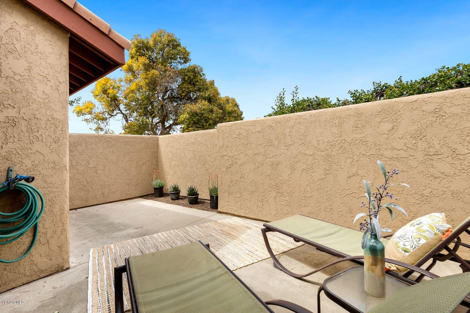 3736 Via Pacifica Walk Oxnard, CA 93035 - Photo 17 of 20 a balcony with table and chairs