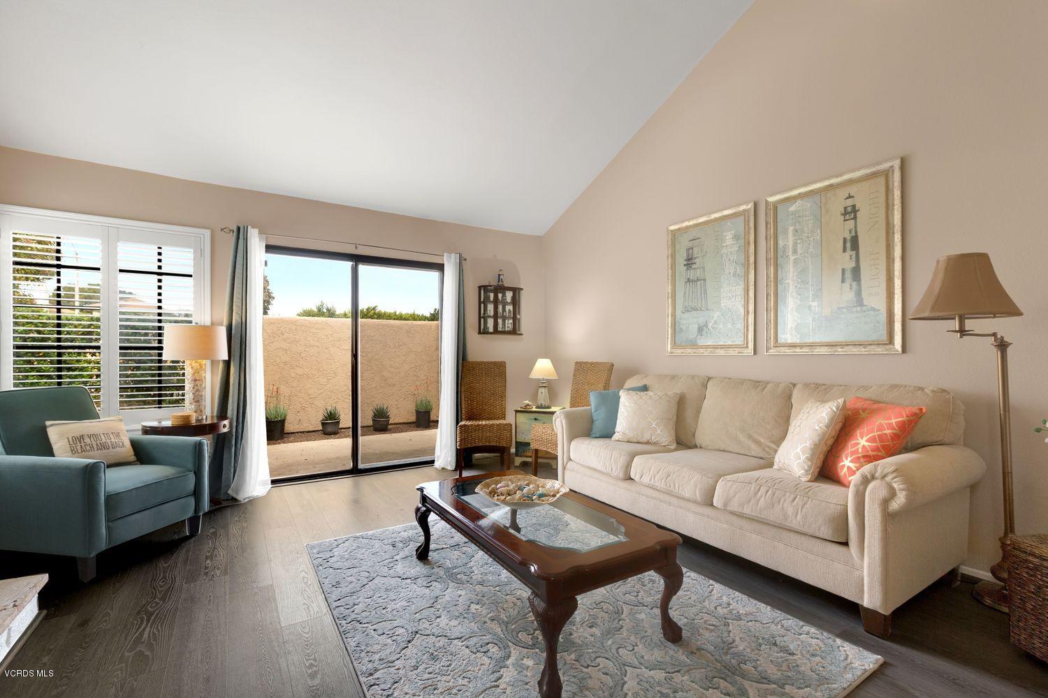 3736 Via Pacifica Walk Oxnard, CA 93035 - Photo 4 of 20 a living room with furniture and a large window