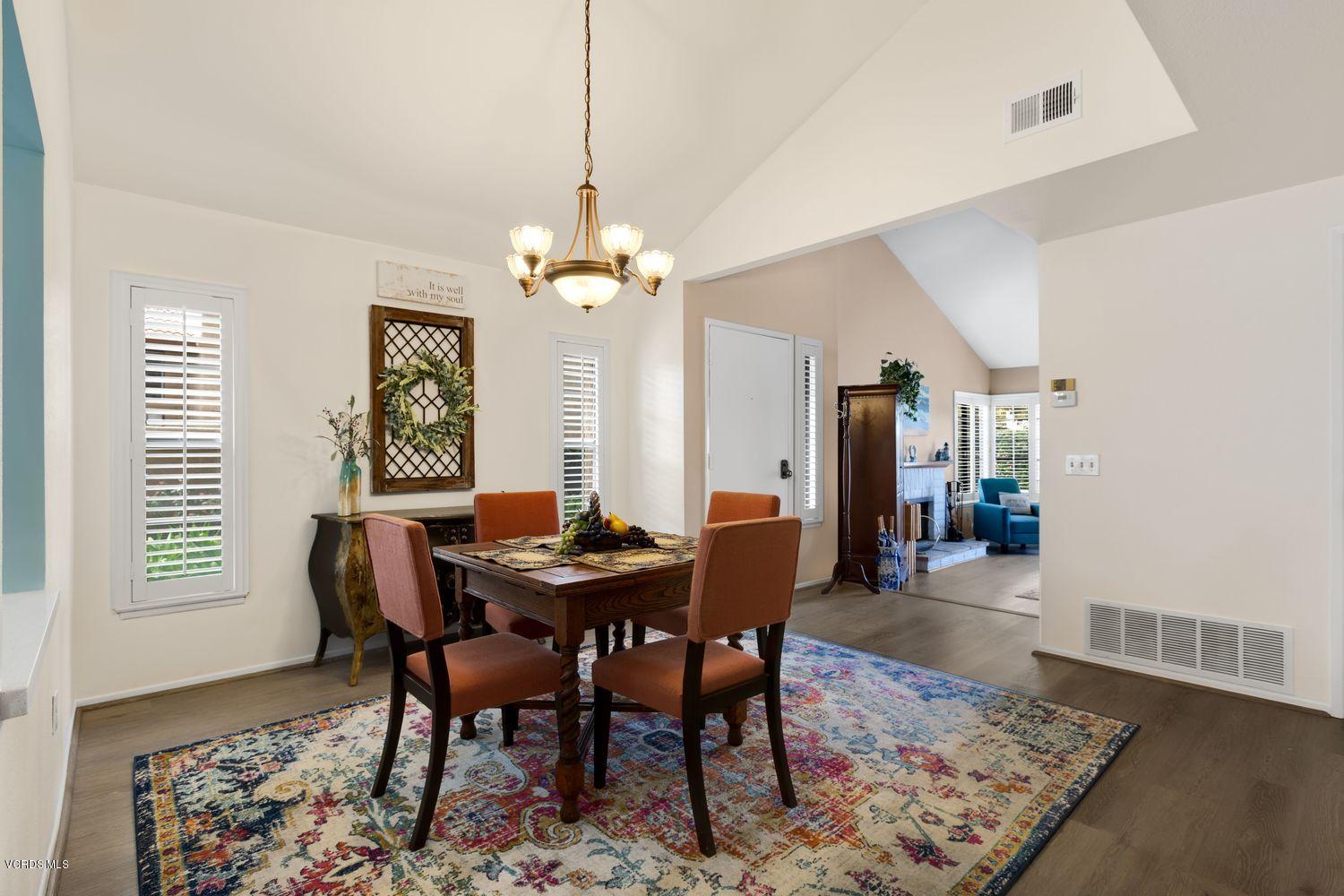 3736 Via Pacifica Walk Oxnard, CA 93035 - Photo 5 of 20 a view of a dining room with furniture and wooden floor