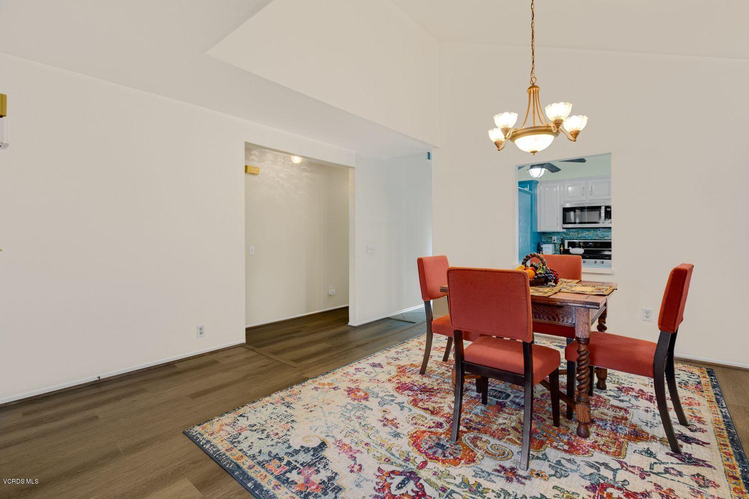 3736 Via Pacifica Walk Oxnard, CA 93035 - Photo 9 of 20 a view of a dining room with furniture and wooden floor
