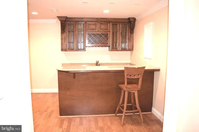 a room with a sink and cabinets