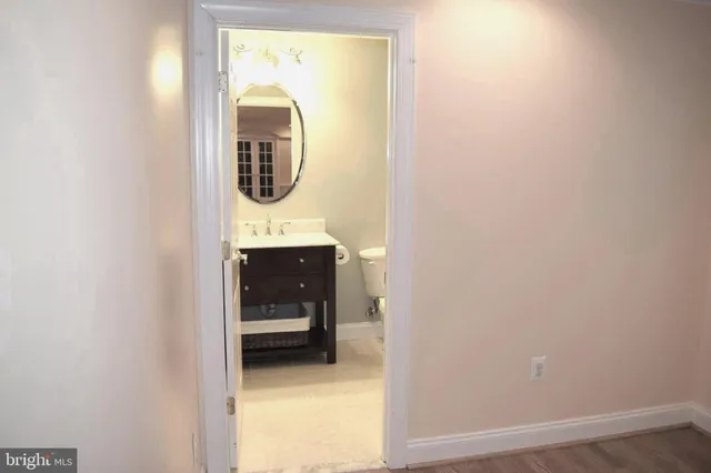 a bathroom with a sink and mirror