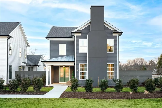 a front view of a house with garden