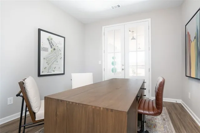 a view of a dining room with furniture and window