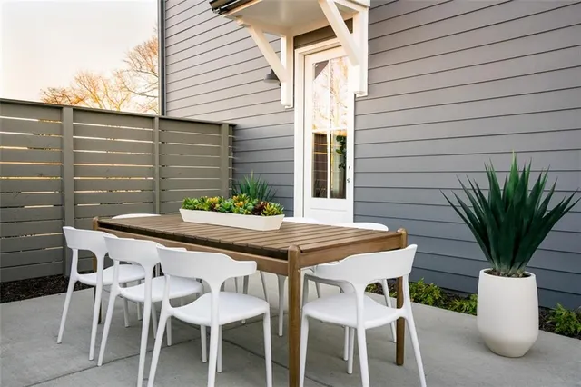 a view of an outdoor seating area with furniture
