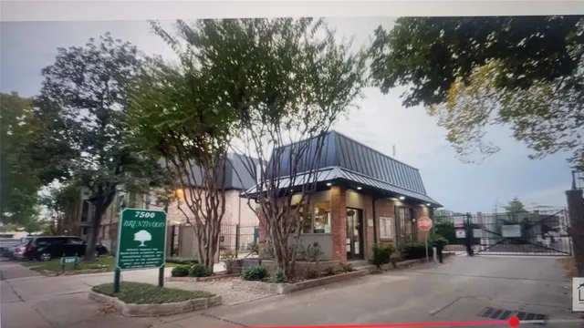 a front view of a building with street view