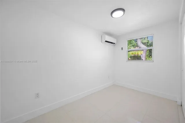 a kitchen with white cabinets stainless steel appliances and sink