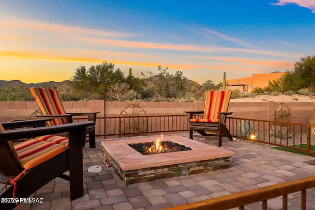 a view of a roof deck with chair and wooden floor