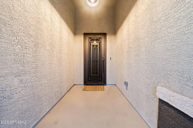 a view of a hallway with brick walls