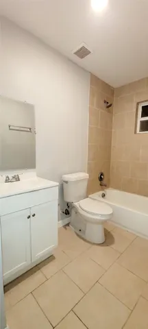 a bathroom with a sink a toilet and tub